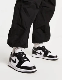 Jordan Aj1 Low Trainers In And Black