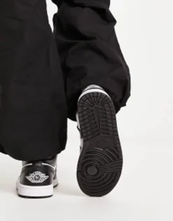 Jordan Aj1 Low Trainers In And Black